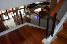 Glass Modern Stair Railing in Wrought Iron Frame